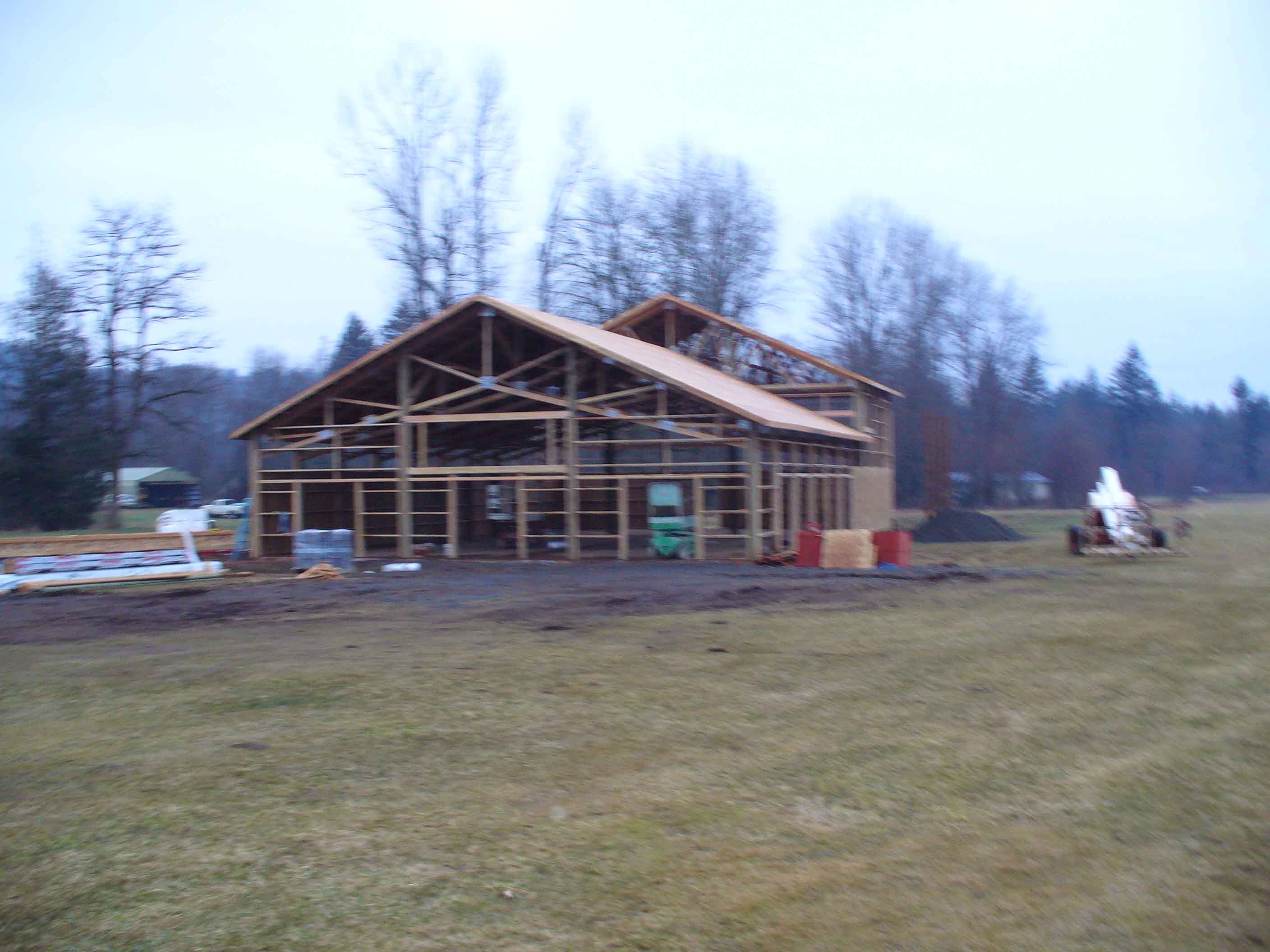 Framed pole building with 1200' living space and large meeting space on private airport