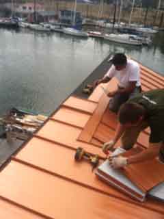 Installing Copper Penny Loc-Seam roof on house boat