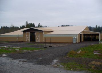 Large horse barn with custom slider doors