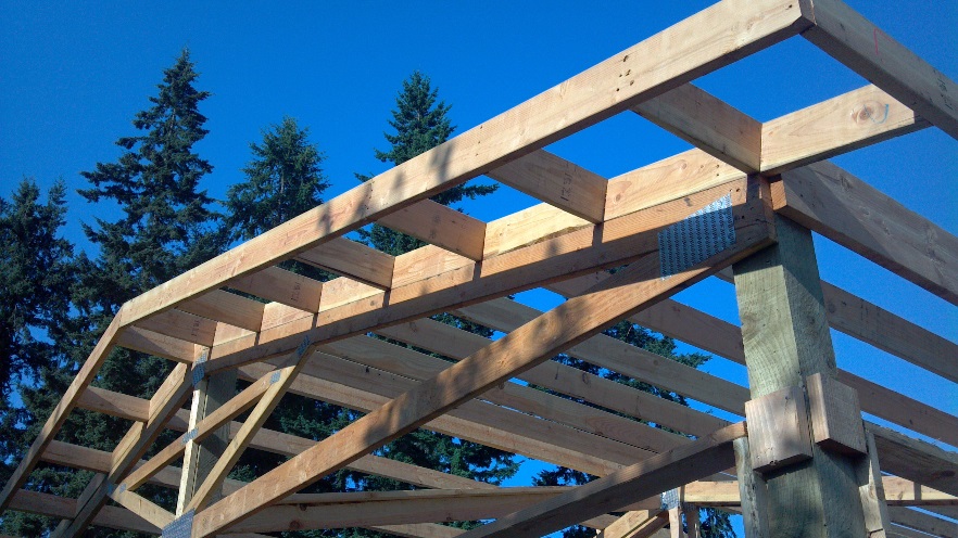 Framed overhang for pole building