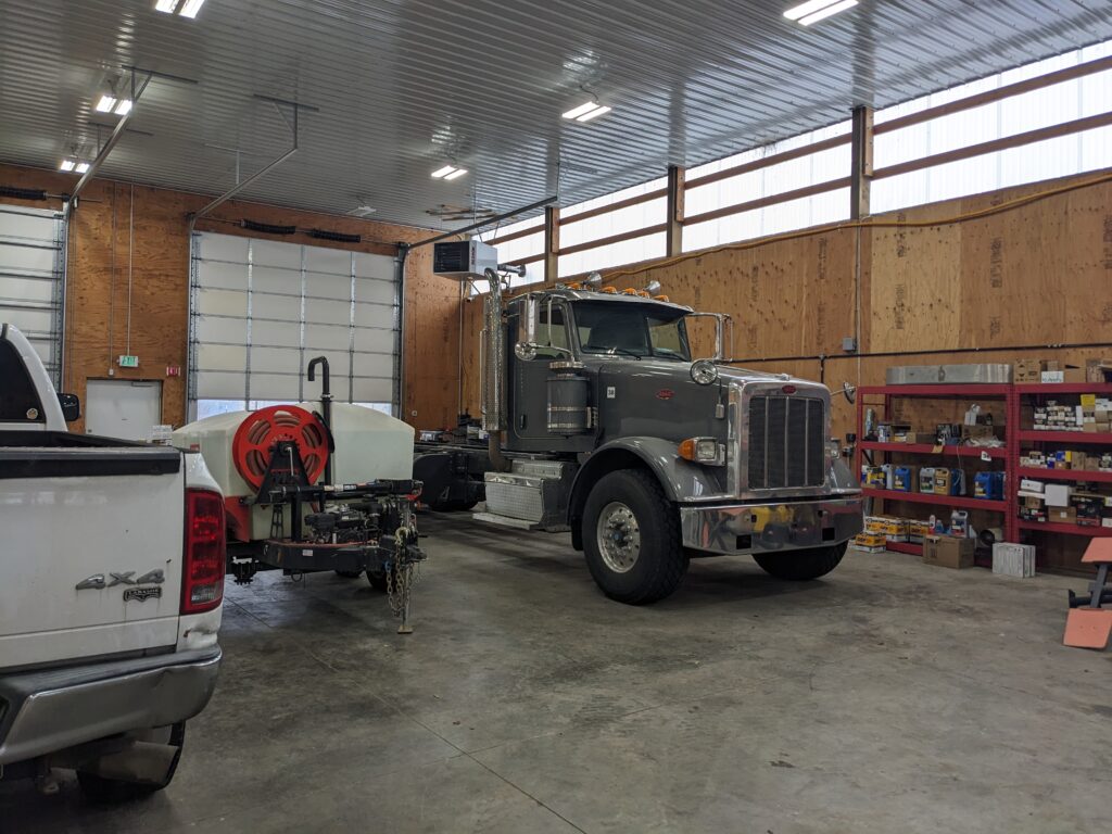 Polycarbonate light panels on a pole building with a semi truck in the automotive shop